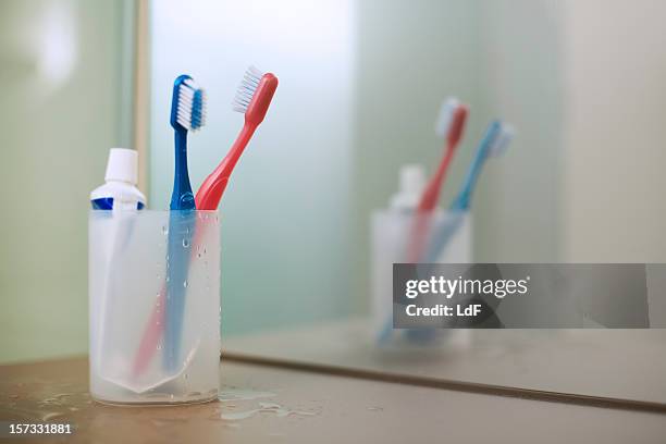 two tooth brushes - toothpaste stock pictures, royalty-free photos & images