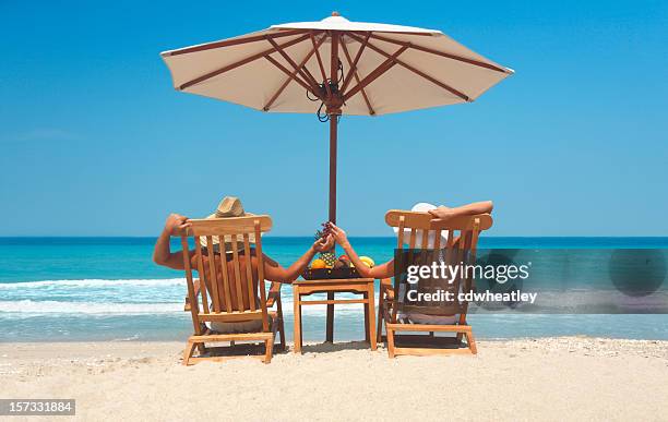 couples getaway - sunbed stock pictures, royalty-free photos & images