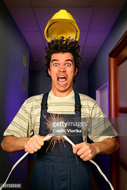 a man is in shock after having a short circuit - electrical shock stock pictures, royalty-free photos & images