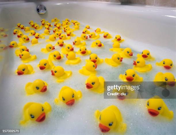 sea of toy ducks - rubber duck stock pictures, royalty-free photos & images