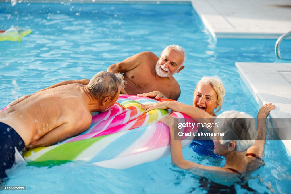 Senior Pool Fun Cheerful Seniors Having Fun On A Pool Raft In Summer Day High-Res Stock ...
