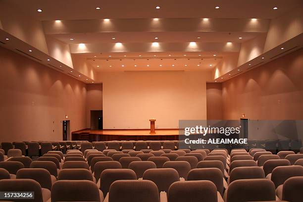 empty auditorium with grey seats and downlights - theatre stage stock pictures, royalty-free photos & images