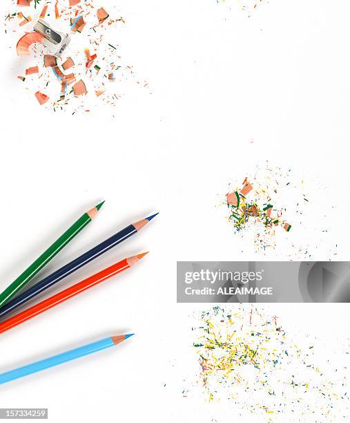 background of sharp colored pencils and shavings on white - sharp stock pictures, royalty-free photos & images