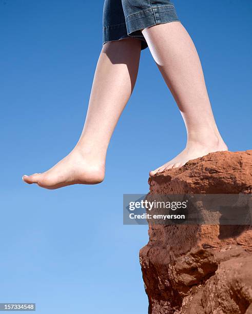 stepping off - stepping off cliff stock pictures, royalty-free photos & images