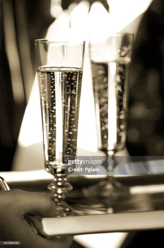 Two Champagne glasses on tray