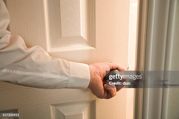 opening door into light unknown room - doorknob bildbanksfoton och bilder