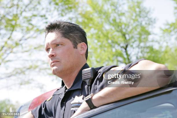 police officer looking away - police siren stock pictures, royalty-free photos & images