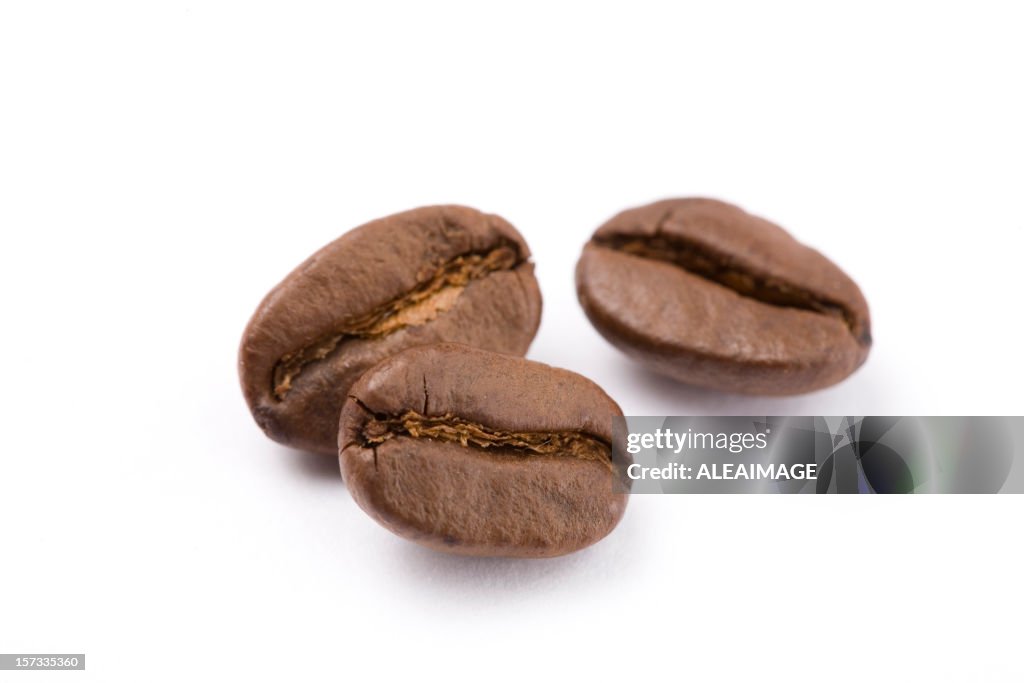 Close up of coffee beans against white background