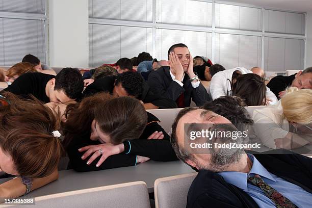 sleeping audience at a boring business seminar - bored audience stock pictures, royalty-free photos & images