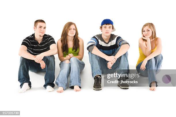 four teen friends sitting in a row - four people white background stock pictures, royalty-free photos & images