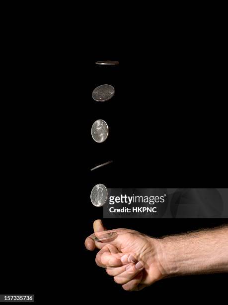 hand coin toss silver dollar - flipping a coin stock pictures, royalty-free photos & images