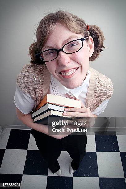 nerd girl looking up - pigeon toed stockfoto's en -beelden