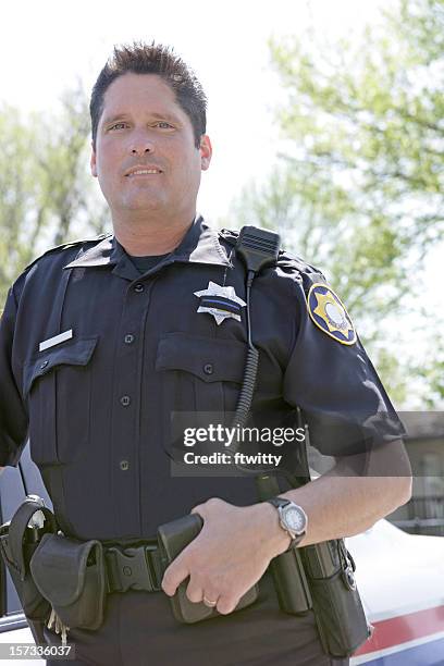 policeman vertical - police officer smiling stock pictures, royalty-free photos & images