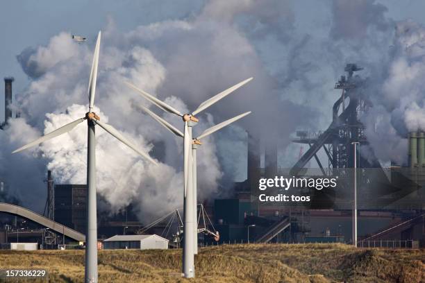 blast furnaces with windmills - condensation furnace stock pictures, royalty-free photos & images