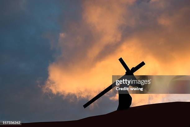 christ carrying the cross on good friday - jesus christ photo stock pictures, royalty-free photos & images