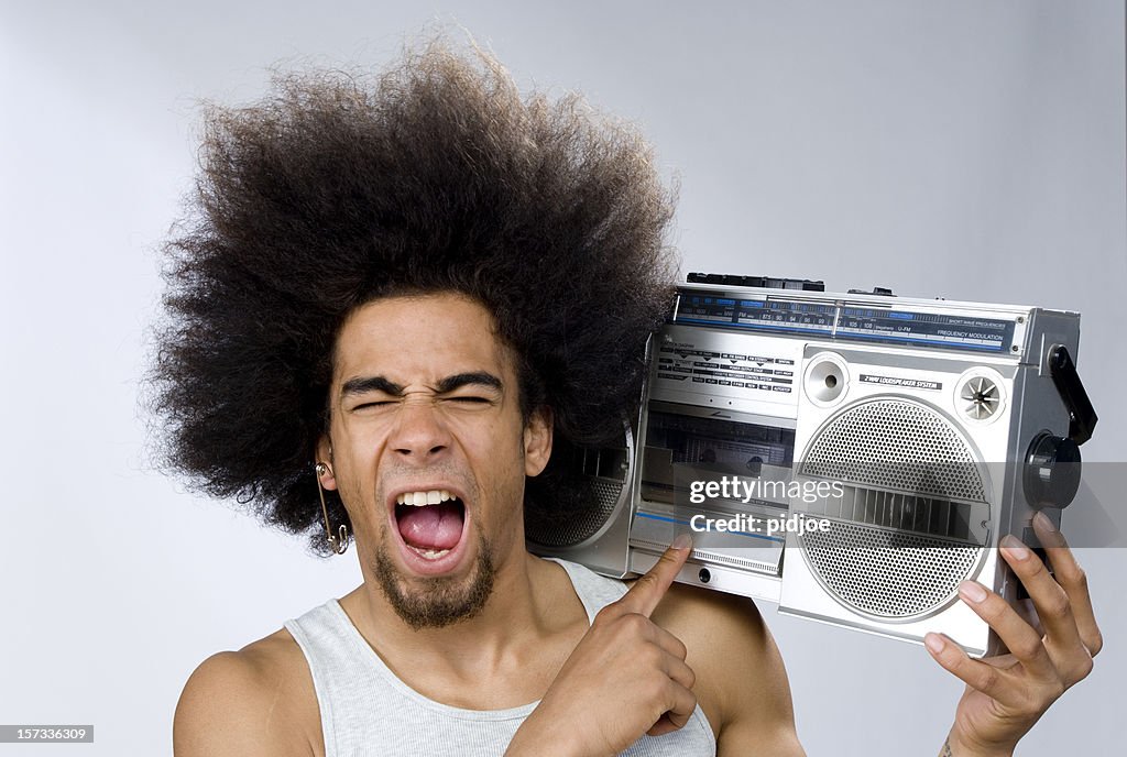 Funky man singing to music on portable radio