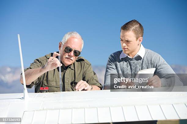 pilot instructor teaching student - airplane fuel gauge stock pictures, royalty-free photos & images