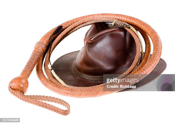 leather whip and hat - brown hat stockfoto's en -beelden