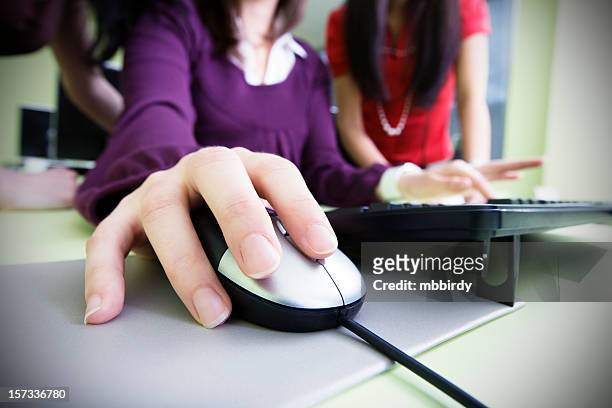 student using computer mouse and keyboard - mouse pad stock pictures, royalty-free photos & images