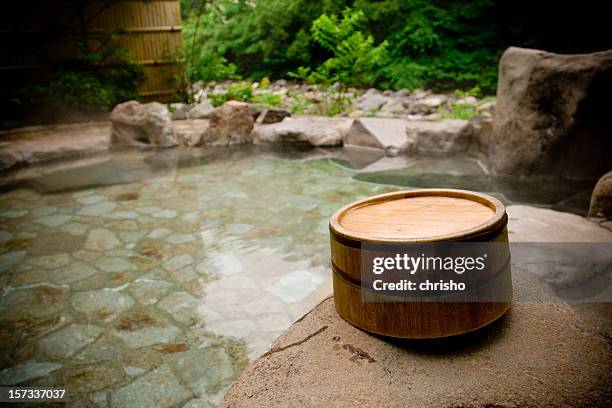 wooden bucket by a japanese hot spring bath - ryokan stock pictures, royalty-free photos & images