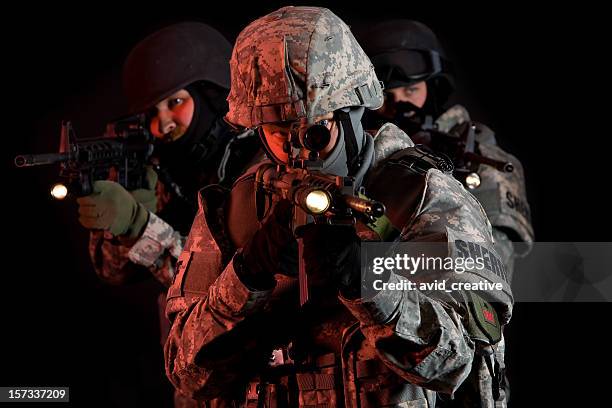 swat team under cover of darkness - police flashlight stock pictures, royalty-free photos & images