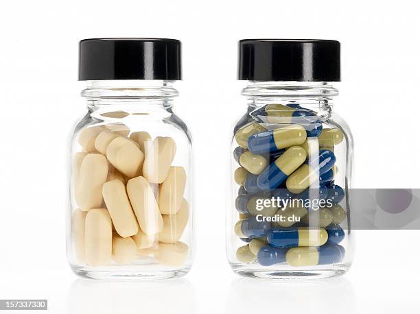 two pills bottles - jar stockfoto's en -beelden