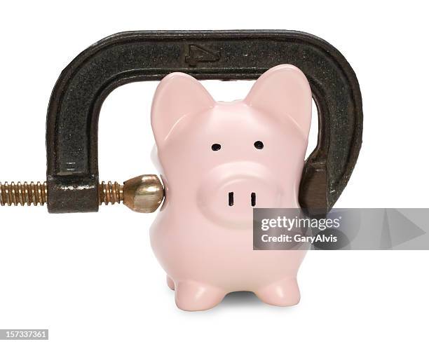 piggy bank w/squeezing c clamp&clipping path - vice grip stock pictures, royalty-free photos & images