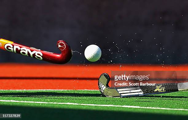 Detail as two players compete for the ball with their hockey sticks during the match between Australia and the Netherlands during day two of the...