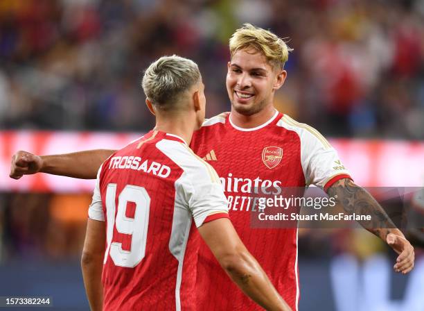 Leandro Trossard of Arsenal is congratulated by teammate Emile Smith Rowe after scoring the team's third goal during the Pre-Season Friendly match...
