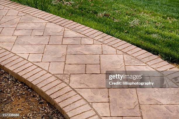 stamped concrete sidewalk - stamped concrete stockfoto's en -beelden