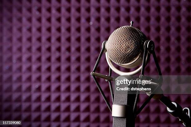 a microphone in a purple recording studio - radio studio stock pictures, royalty-free photos & images