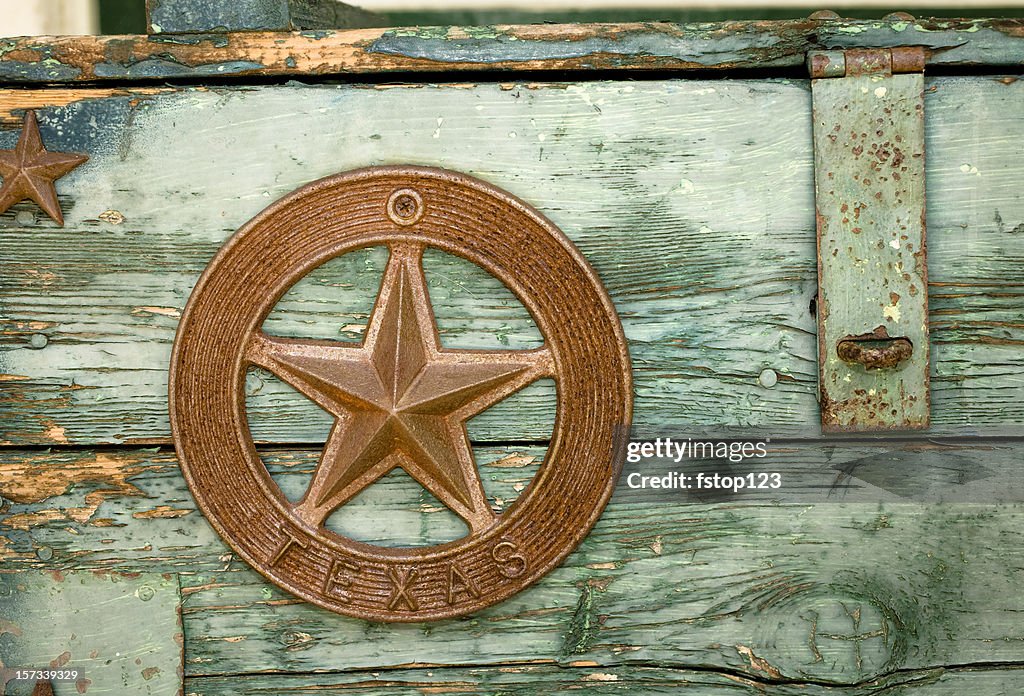 Green paint peeling on Wooden box with Texas star