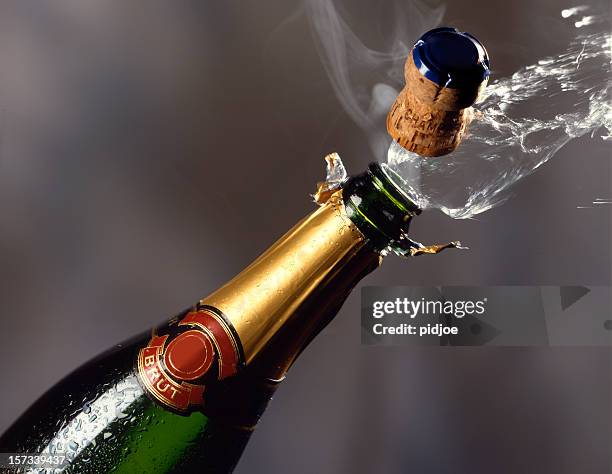 popping champagne cork - champagne label stock pictures, royalty-free photos & images