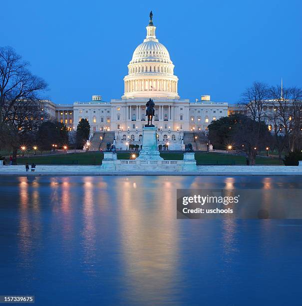 us capitol lit up at night in washing dc - library of congress stock pictures, royalty-free photos & images
