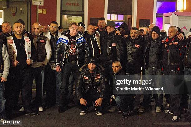 Hells Angels pose after the head of the 'West Central' chapter of the Hells Angels, Christian Mueller , spoke to media following the defection of 30...