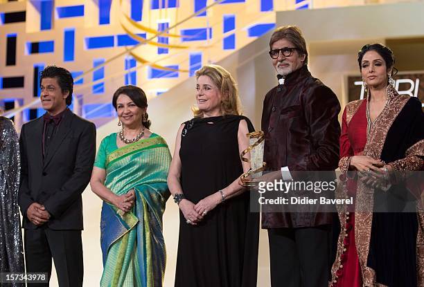 Indian actor Shahrukh Khan, Sharmila Tagore, French actress Catherine Deneuve and Amitabh BachChan attend the Tribute to Hindi Cinema ceremony at the...