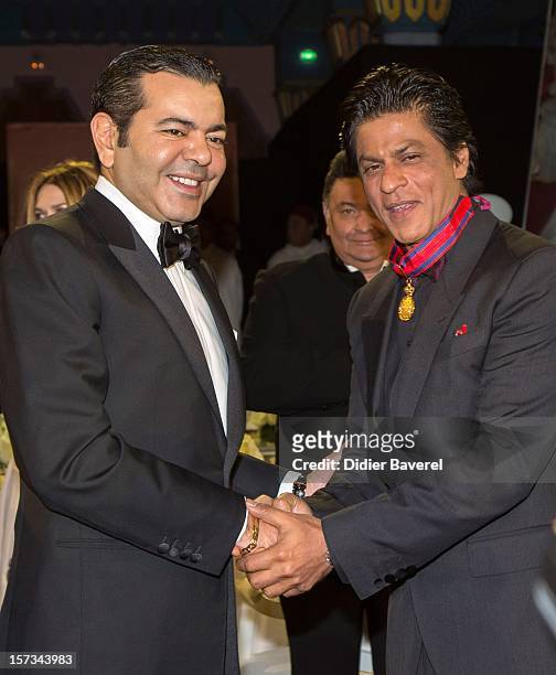 Prince Moulay Rachid of Moroccogives an Honor Medal to Shahrukh Khan before the dinner at the Tribute to Hindi Cinema ceremony at the 12th Marrakech...