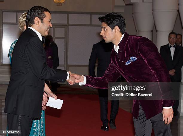 Prince Moulay Rachid of Morocco greets Indian actors before the Gala Dinner at the Tribute to Hindi Cinema ceremony at the 12th Marrakech...