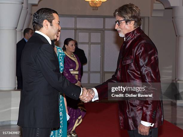 Prince Moulay Rachid of Morocco greets Amitabh Bachchan before the Gala Dinner at the Tribute to Hindi Cinema ceremony at the 12th Marrakech...