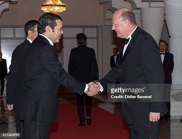 Prince Moulay Rachid of Morocco greets Remy Pfimlin before the Gala Dinner at the Tribute to Hindi Cinema ceremony at the 12th Marrakech...
