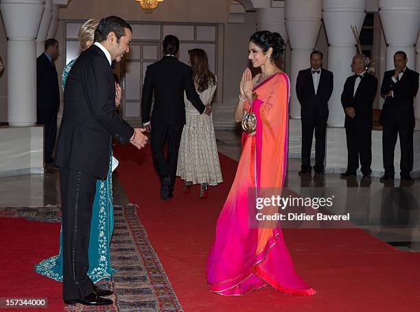 Prince Moulay Rachid of Morocco greets Indian actors before the Gala Dinner at the Tribute to Hindi Cinema ceremony at the 12th Marrakech...