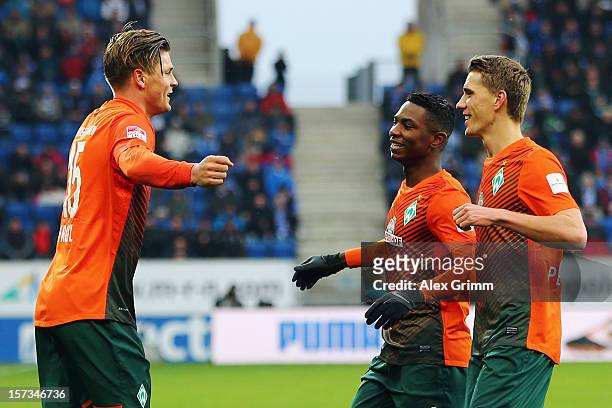 Sebastian Proedl of Bremen celebrates his team's first goal with team mates Eljero Elia and Nils Petersen during the Bundesliga match between TSG...