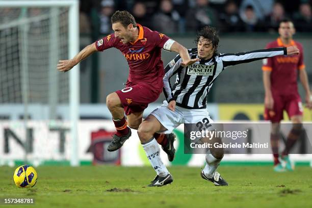 Matteo Contini of AC Siena fights for the ball with Francesco Totti of AS Roma during the Serie A match between AC Siena and AS Roma at Stadio...