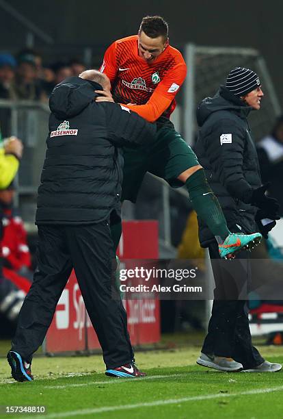 Marko Arnautovic of Bremen celebrates his team's fourth goal with head coach Thomas Schaaf during the Bundesliga match between TSG 1899 Hoffenheim...