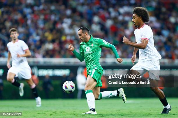 Juan Miguel Jimenez of Betis competes for the ball with Loic Bade os Sevilla during the preseason friendly match between Sevilla and Betis at Akron...