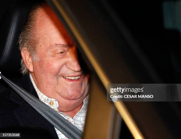 Spain's King Juan Carlos leaves the Hospital Quiron San Jose on December 2, 2012 in Madrid. King Juan Carlos underwent a hip replacement operation on...