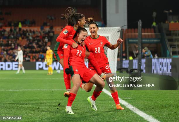 Telma Encarnacao of Portugal celebrates with teammates Jessica Silva and Kika Nazareth after scoring her team's first goal during the FIFA Women's...