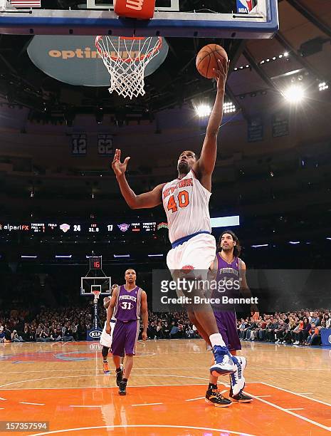 Kurt Thomas of the New York Knicks scores two against the Phoenix Suns at Madison Square Garden on December 2, 2012 in New York City. NOTE TO USER:...
