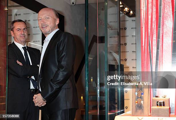 Director Paul Haggis and President of Vhernier Carlo Traglio attend the Artists For Peace And Justice Cocktail at Vhernier Boutique on December 2,...