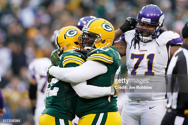 Raji and Jerron McMillian of the Green Bay Packers celebrate against the Minnesota Vikings during the game at Lambeau Field on December 2, 2012 in...
